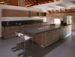 Contemporary Fiamma kitchens use smooth cabinet fronts banded with stripes dark grain