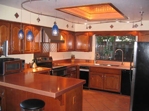 Copper Countertops and pans hanging racks from Frigo Design make your kitchen different