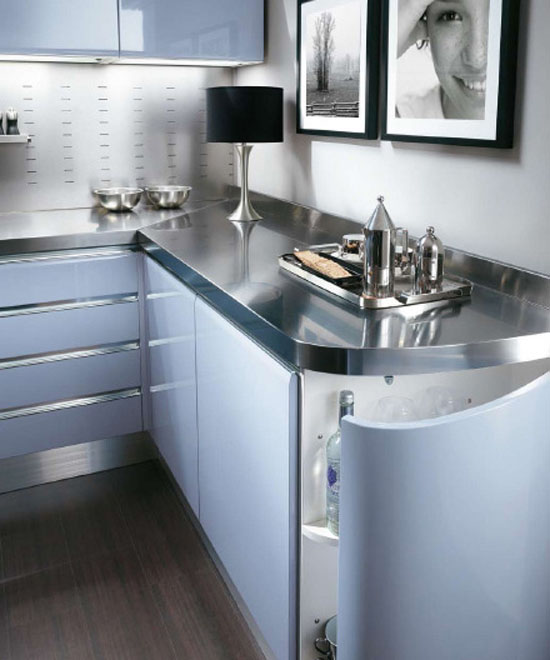 Modern baby blue kitchen with high specification molded cupboards and stainless steel tops