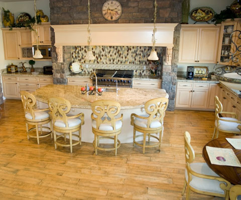 The rounded design on the dining side kitchen island