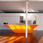 Unusual bright orange Kitchen Island combination of old and new traditions by A-EM Architects