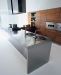 Walnut kitchen slats with black fillets give strong units linear look Walnut kitchen slats with black fillets give strong units linear look