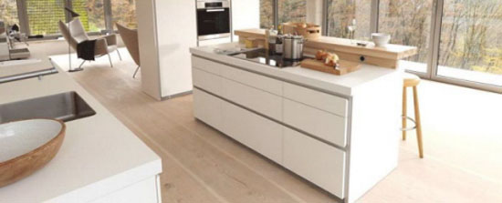 great white kitchen design reducing six large drawers for storage by Bulthaup