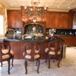 kitchen island features elegant cherry wood panelled cabinets