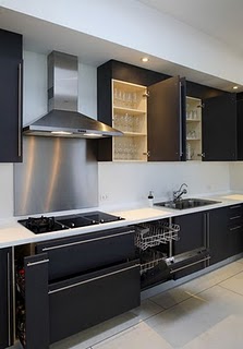 modern kitchen with black cabinets to store bottles or cans