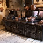natural building materials of a traditional turn of the century French country kitchen