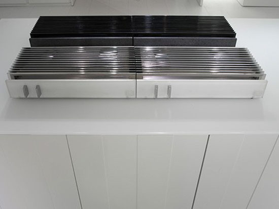 natural lava stone, wood steel and aluminium achieves geometrical harmony Italian white kitchen design