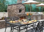 outdoor kitchens or open air kitchen linked with pool and garden