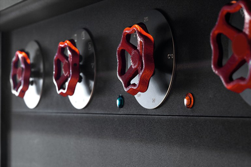 red-colored knobs of timeless classic style of kitchen design with black metal