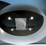round kitchen island features over head lighting hood vent double sink