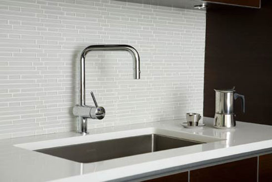 white glas tiles backsplash contrast dark cabinetry provides the clean line