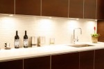 white glass tiles backsplash contrast dark cabinetry provides the clean lines